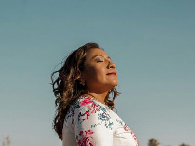 Side profile of a man sitting calmly and breathing deeply.